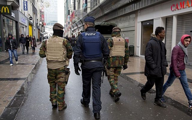 Belgian soldiers and police patrol an otherwise busy shopping street in Brussels on Saturday, November 21, 2015. (AP/Virginia Mayo) Belgian soldiers and police patrol an otherwise busy shopping street in Brussels on Saturday, November 21, 2015. (AP/Virginia Mayo)