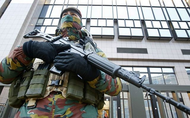 A Belgian police officer guards the building of the European Commission in Brussels, Belgium, Tuesday, Nov. 24, 2015. (AP Photo/Michael Probst) A Belgian police officer guards the building of the European Commission in Brussels, Belgium, Tuesday, Nov. 24, 2015. (AP Photo/Michael Probst)