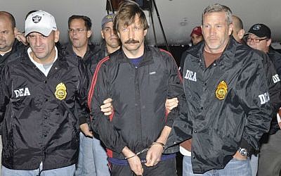 Suspected Russian arms dealer Viktor Bout (center) is escorted by US Drug Enforcement Administration (DEA) officers after arriving in New York, November 16, 2010. (Courtesy of DEA)