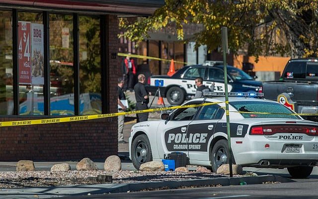 The rear window of a police car is shattered after a shooting Saturday, Oct. 31, 2015, in Colorado Springs, Colorado that left several people dead, including a suspected gunman. (Christian Murdock/The Gazette via AP) The rear window of a police car is shattered after a shooting Saturday, Oct. 31, 2015, in Colorado Springs, Colorado that left several people dead, including a suspected gunman. (Christian Murdock/The Gazette via AP)