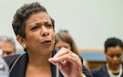 US Attorney General Loretta Lynch adjusts her microphone prior to testifying on Capitol Hill in Washington, Tuesday, Nov. 17, 2015, before the House Judiciary Committee. (AP Photo/Andrew Harnik)