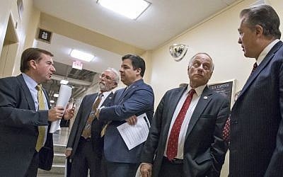 From left, House Foreign Affairs Committee Chairman Rep. Ed Royce, R-Calif., Rep. Dan Newhouse R-Wash., Rep. Raul Labrador, R-Idaho, Rep. Steve King, R-Iowa, and Rep. Trent Franks, R-Ariz., confer on Capitol Hill in Washington, Wednesday, Nov. 18, 2015, following a meeting of the conservative Republican Study Committee ahead of legislation aimed at increasing screenings for Syrian and Iraqi refugees before they enter the US, including a requirement for FBI background checks. (AP/J. Scott Applewhite)