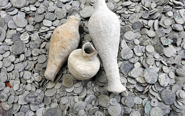 Ancient coins and jars confiscated from an antiquities dealer in northern Israel suspected of illegal sale of artifacts on November 24, 2015. (Israel Antiquities Authority) Ancient coins and jars confiscated from an antiquities dealer in northern Israel suspected of illegal sale of artifacts on November 24, 2015. (Israel Antiquities Authority)