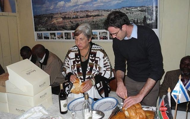 Barbara Steenstrup, the editor of "Shelanu," the newsletter of the Nairobi Hebrew Congregation, visited a community of 1,500 self-identified Jews in Nyahruru. The elders were thrilled to try challah, purchased from Israeil-owned Artcafe, the Kenyan knockoff of Arcafe. (courtesy Barbara Steenstrup/Nairobi Hebrew Congregation)