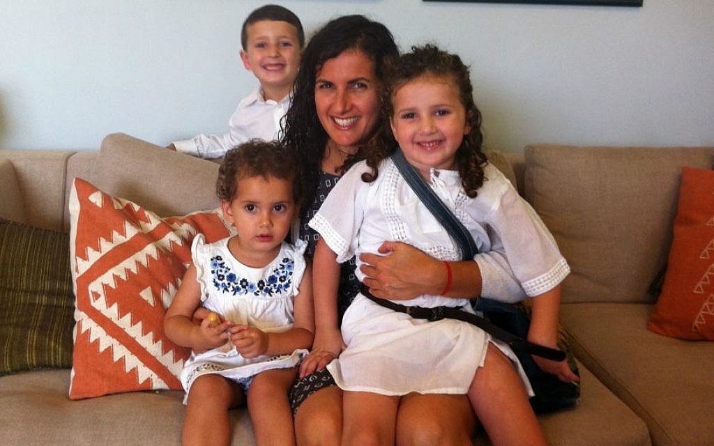 Spiritual parenting expert Dasee Berkowitz and her three children in their Jerusalem home. (courtesy)
