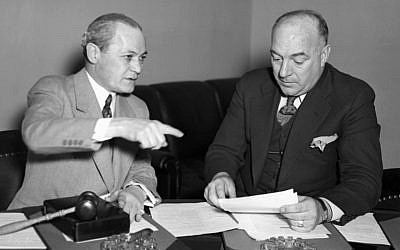 Chairman Samuel Dickstein, left, of the House Immigration Committee, discussing the bill of Rep. William Schulte, D-Ind., to restrict immigration into the United States from Mexico, March 7, 1934. (AP Images, via JTA)