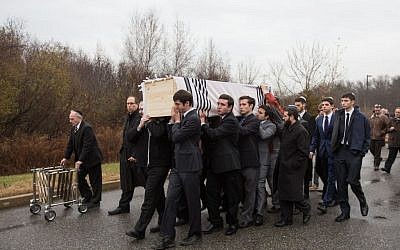Following the funeral of Ezra Schwartz, 18, an American yeshiva student who was murdered in a Palestinian terror attack in Israel last week, friends carry the slain teen's casket outside Temple Sinai in Sharon, Massachusetts on November 22, 2015 (Elan Kawesch/The Times of Israel) Following the funeral of Ezra Schwartz, 18, an American yeshiva student who was murdered in a Palestinian terror attack in Israel last week, friends carry the slain teen's casket outside Temple Sinai in Sharon, Massachusetts on November 22, 2015 (Elan Kawesch/The Times of Israel)