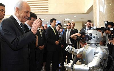 Then-Israeli President Shimon Peres meets the humanoid robot "Hubo" during his visit at the Korea Advanced Institute of Science and Technology (KAIST) in Daejeon, South Korea in 2010. Moshe Milner/GPO/Flash90)