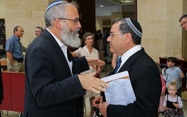 Rabbi David Stav of Shoham talks to Rabbi Shlomo Riskin of Efrat, July 2, 2015. (Gershon Elinson/Flash90)