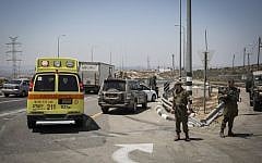 Illustrative: An ambulance at the scene of a stabbing attack on Route 443 on August 15, 2015. (Hadas Parush/Flash90)