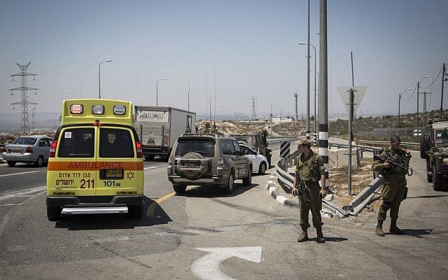 Illustrative: An ambulance at the scene of a stabbing attack on Route 443 on August 15, 2015. (Hadas Parush/Flash90) Illustrative: An ambulance at the scene of a stabbing attack on Route 443 on August 15, 2015. (Hadas Parush/Flash90)