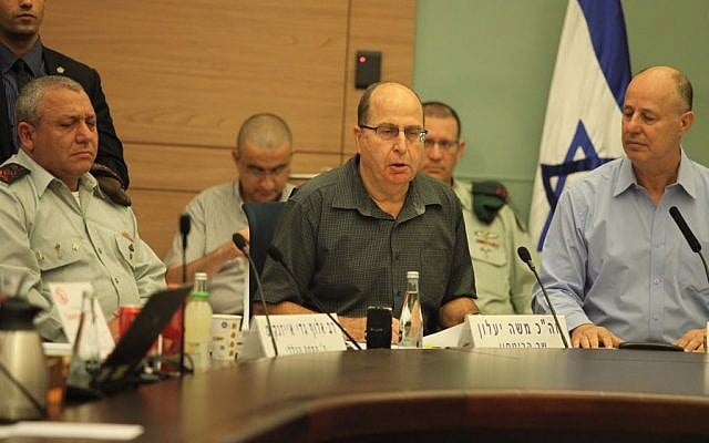 Defense Minister Moshe Ya'alon speaks to the Knesset's Foreign Affairs and Defense Committee on November 3, 2015. He is flanked by committee chair Tzachi Hanegbi and IDF Chief of Staff Gadi Eisenkot. (Issac Harari/Flash90) Defense Minister Moshe Ya'alon speaks to the Knesset's Foreign Affairs and Defense Committee on November 3, 2015. He is flanked by committee chair Tzachi Hanegbi and IDF Chief of Staff Gadi Eisenkot. (Issac Harari/Flash90)
