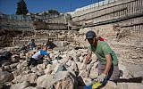 Archaeologists work near remains of the Acra citadel and tower in the City of David in Jerusalem. (Yonatan Sindel/Flash90)