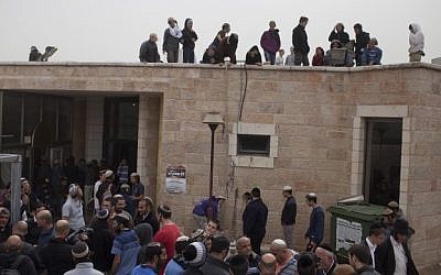 Right-wing activists seen at the Ayelet Hashahar synagogue in the West Bank settlement of Givat Ze'ev, north of Jerusalem, on November 4, 2015. The shul is slated for demolition. (Lior Mizrahi/Flash90)
