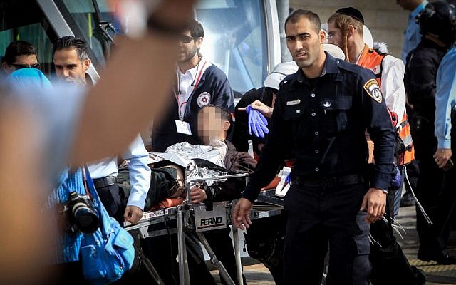Israeli medics and emergency personnel evacuate an injured light rail security guard from the scene of a stabbing in the Jerusalem neighborhood of Pisgat Zeev, November 10, 2015. (Photo by Muammar Awad/Flash90)