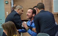 Israeli parliament member Itzik Shmuli is escorted out from a debate regarding the Israeli Jewish anti-assimilation 'Lehava' organization at the Interior Affairs committee meeting in the Knesset on November 10, 2015. (Yonatan Sindel/FLASH90 )