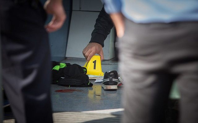 Investigators at the scene of a stabbing attack on the light rail in the northern Jerusalem neighborhood of Pisgat Ze'ev, November 10, 2015. (Yonatan Sindel/Flash90) Investigators at the scene of a stabbing attack on the light rail in the northern Jerusalem neighborhood of Pisgat Ze'ev, November 10, 2015. (Yonatan Sindel/Flash90)