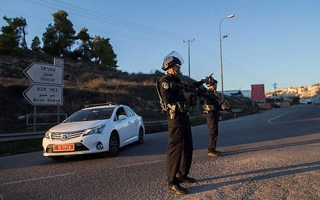 Illustrative: Israeli security police stand near the Otniel Junction in the southern West Bank on November 13, 2015. (Yonatan SIndel/Flash90) Illustrative: Israeli security police stand near the Otniel Junction in the southern West Bank on November 13, 2015. (Yonatan SIndel/Flash90)