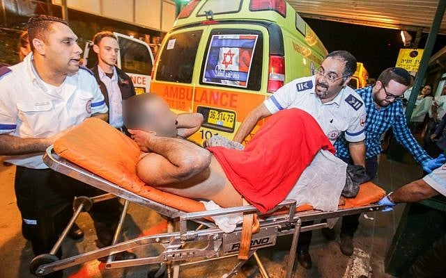 Medical personnel rush an Israeli man to the emergency unit at Barzilai Hospital in Ashkelon after he was wounded in a stabbing attack in the southern Israeli city of Kiryat Gat, on November 21, 2015. (Edi Israel/Flash90) Medical personnel rush an Israeli man to the emergency unit at Barzilai Hospital in Ashkelon after he was wounded in a stabbing attack in the southern Israeli city of Kiryat Gat, on November 21, 2015. (Edi Israel/Flash90)