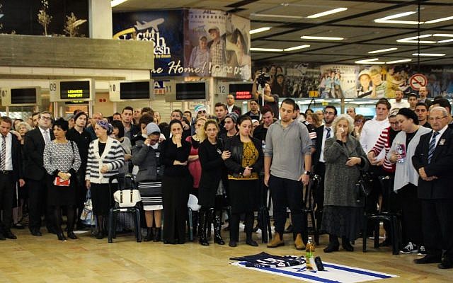 Friends and family attend a ceremony in memory of Ezra Schwartz at Ben Gurion international airport on Saturday night, November 21, 2015 (Moti Karelitz/ZAKA TEL AVIV) Friends and family attend a ceremony in memory of Ezra Schwartz at Ben Gurion international airport on Saturday night, November 21, 2015 (Moti Karelitz/ZAKA TEL AVIV)