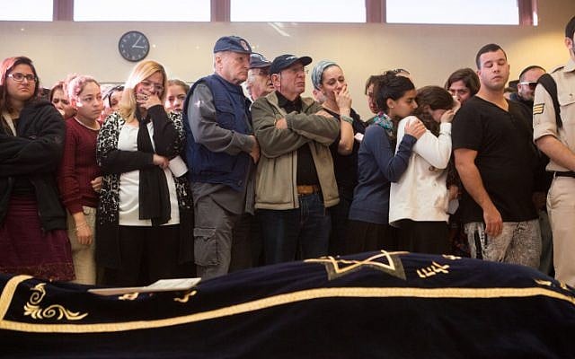 Mourners seen near the body of Hadar Buchris, 21, during her funeral in Jerusalem on November 23, 2015. (Mirian Alster/Flash90) Mourners seen near the body of Hadar Buchris, 21, during her funeral in Jerusalem on November 23, 2015. (Mirian Alster/Flash90)