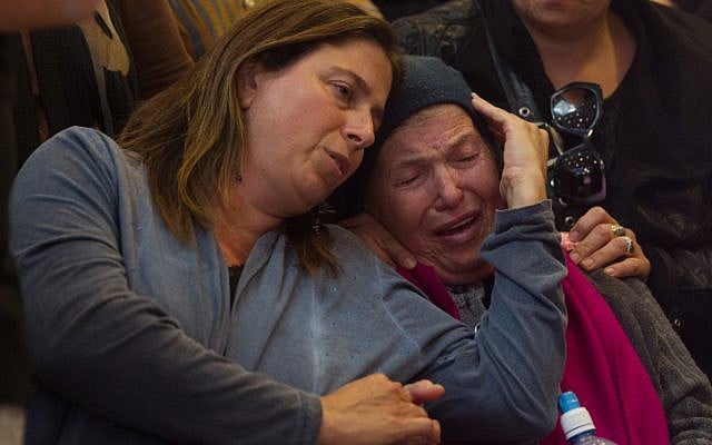 Mourners react during the funeral of Hadar Buchris, 21, in Jerusalem on November 23, 2015. (Mirian Alster/Flash90) Mourners react during the funeral of Hadar Buchris, 21, in Jerusalem on November 23, 2015. (Mirian Alster/Flash90)