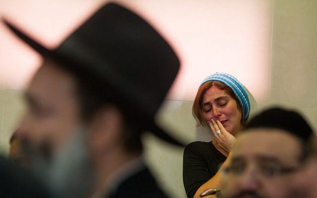 Mourners react during the funeral of Hadar Buchris, 21, in Jerusalem on November 23, 2015. (Mirian Alster/Flash90) Mourners react during the funeral of Hadar Buchris, 21, in Jerusalem on November 23, 2015. (Mirian Alster/Flash90)