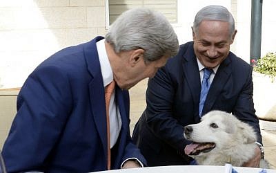 US Secretary of State John Kerry pets Kaia, the dog of Prime Minister Benjamin Netanyahu, as Kerry and Netanyahu meet at the PM's official residence in Jerusalem, on November 24, 2015. (Photo by Matty Stern/US Embassy Tel Aviv)