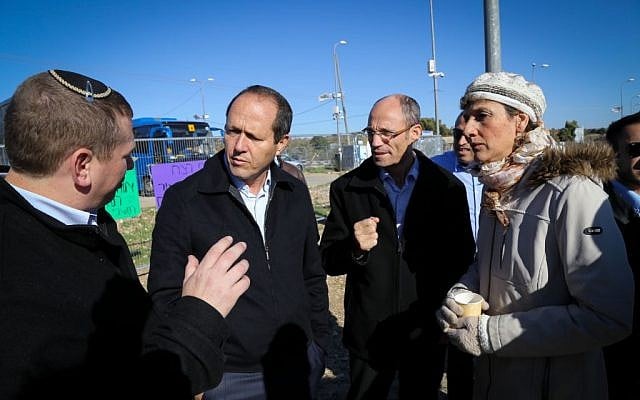 Jerusalem Mayor Nir Barkat, second left, Etzion Bloc Regional Council leader Davidi Perl, second right, and other local politicians discuss security measures at Etzion Junction in the West Bank, south of Jerusalem on November 24, 2015. (Gershon Elinson/FLASH90)
