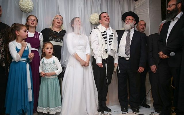 Friends and family attend the wedding of Sarah Litman and Ariel Beigel at the Jerusalem International Convention Center, November 26, 2015. (Hadas Parush/Flash90) Friends and family attend the wedding of Sarah Litman and Ariel Beigel at the Jerusalem International Convention Center, November 26, 2015. (Hadas Parush/Flash90)