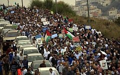 Thousands of supporters of the Islamic Movement in Israel, and its Northern Branch leader, Sheikh Raed Salah, demonstrate against Israel's decision to outlaw the Northern Branch, on November 28, 2015, in Umm al-Fahm, northern Israel. (Muammar Awad/Flash90)