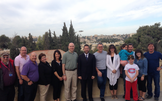 Former MK Dov Lipman with Rabbi Fishman and his flock in Jerusalem