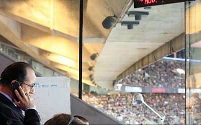France's President Francois Hollande in the security control room at the Stade de France stadium in Saint Denis, north of Paris, during the international friendly soccer match between France and Germany following the first in a series of blasts across Paris, Novmber 13, 2015. (Photo by French Presidential Palace via AP)