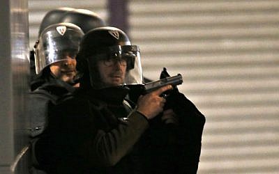 Police forces prepare in Saint Denis, a northern suburb of Paris, Wednesday, Nov. 18, 2015 (AP Photo/Francois Mori)