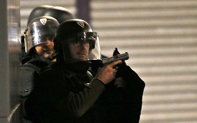 Police forces prepare in Saint Denis, a northern suburb of Paris, Wednesday, Nov. 18, 2015 (AP Photo/Francois Mori) Police forces prepare in Saint Denis, a northern suburb of Paris, Wednesday, Nov. 18, 2015 (AP Photo/Francois Mori)