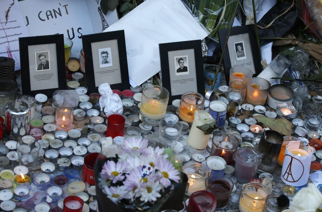 Pictures of victims are placed behind candles outside the Bataclan concert hall in Paris, Sunday, Nov. 15, 2015. (AP Photo/Christoph Ena) Pictures of victims are placed behind candles outside the Bataclan concert hall in Paris, Sunday, Nov. 15, 2015. (AP Photo/Christoph Ena)