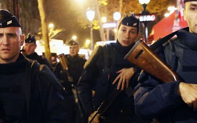 French police patrol at the place de la Republique in Paris, France, November 15, 2015, two days after over 120 people were killed in a series of shooting and explosions. (AP/Jerome Delay) 