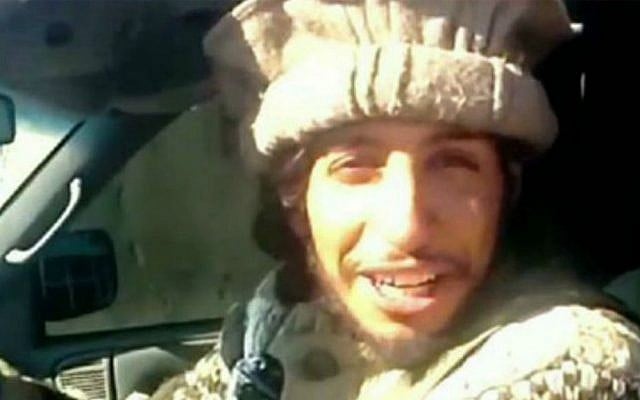 This undated image taken from a jihadist website on Monday Nov. 16, 2015 shows Abdelhamid Abaaoud smiling before dragging mutilated bodies behind his truck in Syria. (Jihadist video via AP) This undated image taken from a jihadist website on Monday Nov. 16, 2015 shows Abdelhamid Abaaoud smiling before dragging mutilated bodies behind his truck in Syria. (Jihadist video via AP)