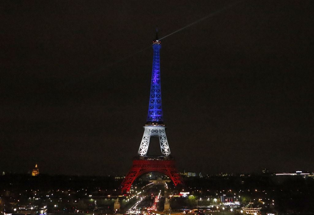 The Eiffel Tower is illuminated in the French national colors red, white and blue in honor of the victims of the terror attacks last Friday in Paris, Monday, Nov. 16, 2015 (AP Photo/Frank Augstein) The Eiffel Tower is illuminated in the French national colors red, white and blue in honor of the victims of the terror attacks last Friday in Paris, Monday, Nov. 16, 2015 (AP Photo/Frank Augstein)