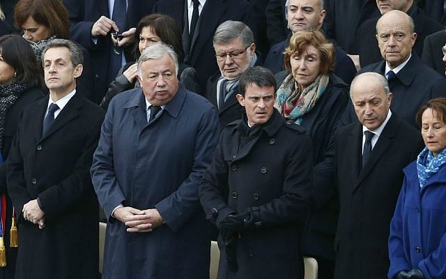 From left, Paris mayor Anne Hidalgo, former French president Nicolas Sarkozy, Senate house speaker Gerard Larcher, Prime Minister Manuel Valls, Foreign Minister Laurent Fabius and Environment Minister Segolene Royal wait for the start of a ceremony in the courtyard of the Invalides in Paris, Friday, Nov. 27, 2015. (AP Photo/Francois Mori) From left, Paris mayor Anne Hidalgo, former French president Nicolas Sarkozy, Senate house speaker Gerard Larcher, Prime Minister Manuel Valls, Foreign Minister Laurent Fabius and Environment Minister Segolene Royal wait for the start of a ceremony in the courtyard of the Invalides in Paris, Friday, Nov. 27, 2015. (AP Photo/Francois Mori)
