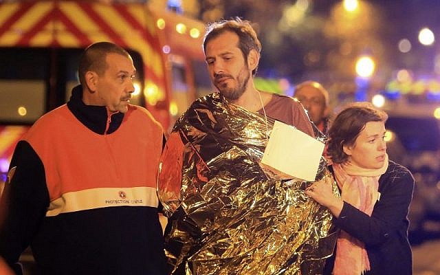 A man is being evacuated from the Bataclan theater after a shooting in Paris, Friday Nov. 13, 2015. (AP/Thibault Camus) A man is being evacuated from the Bataclan theater after a shooting in Paris, Friday Nov. 13, 2015. (AP/Thibault Camus)