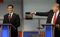 Marco Rubio laughs as Donald Trump makes a point during the fourth Republican primary debate at Milwaukee Theatre, Tuesday, Nov. 10, 2015, in Milwaukee, Wisconsin. (AP Photo/Jeffrey Phelps)
