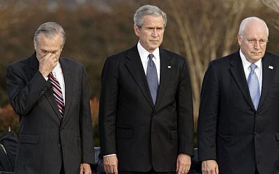Secretary of Defense Donald Rumsfeld, left, pauses as President George W. Bush, and Vice President Dick Cheney participate in Rumsfeld's farewell ceremony at the Pentagon in Washington, Dec. 15, 2006. (AP Photo/J. Scott Applewhite, File)