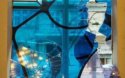 A smashed window photographed in the synagogue in Cottbus, eastern Germany, Wednesday November 18, 2015. (Patrick Pleul/dpa via AP)