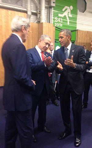 Benjamin Netanyahu, center, speaking with Barack Obama, right, on the sidelines of the Paris climate summit on November 30, 2011. (courtesy)