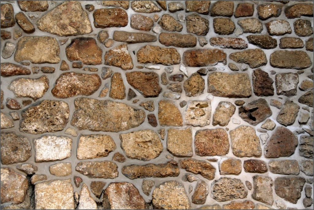 The mix of Ottoman and Crusader-era stones in one of the ancient walls in Evan Fallenberg's new Acre home (Courtesy Elana Seger)