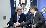 US Secretary of State John Kerry, left, and Kyrgyz Foreign Minister Erlan Abdyldaev shake hands during a ribbon cutting ceremony at the US Embassy on Saturday Oct. 31, 2015 in Bishkek. (Brendan Smialowski/Pool via AP)