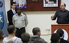 Defense Minister Moshe Ya'alon addresses a group of new recruits at the IDF's enlistment center in Kiryat Ono outside of Tel Aviv on November 30, 2015. (Judah Ari Gross/Times of Israel)