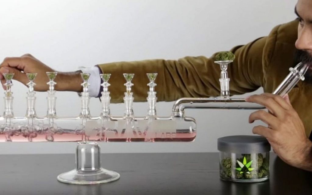The Grav Menorah is a cross between a glass bong and a traditional hanukiah which retails for $699. (YouTube screenshot) The Grav Menorah is a cross between a glass bong and a traditional hanukiah which retails for $699. (YouTube screenshot)