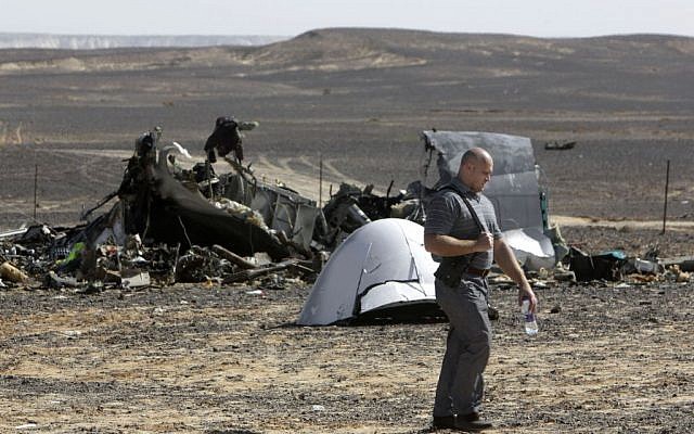 A Russian investigator walks near wreckage November 1, 2015, a day after a passenger jet bound for St. Petersburg, Russia, crashed in Hassana, Egypt. (AP/Amr Nabil, File) A Russian investigator walks near wreckage November 1, 2015, a day after a passenger jet bound for St. Petersburg, Russia, crashed in Hassana, Egypt. (AP/Amr Nabil, File)